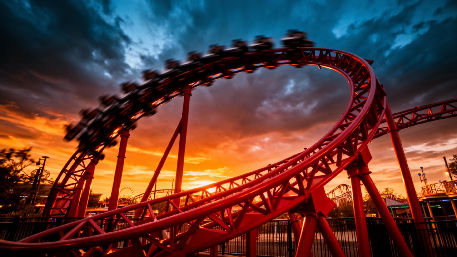 Red rollercoaster looping under a fiery sunset sky at Thorpe Park